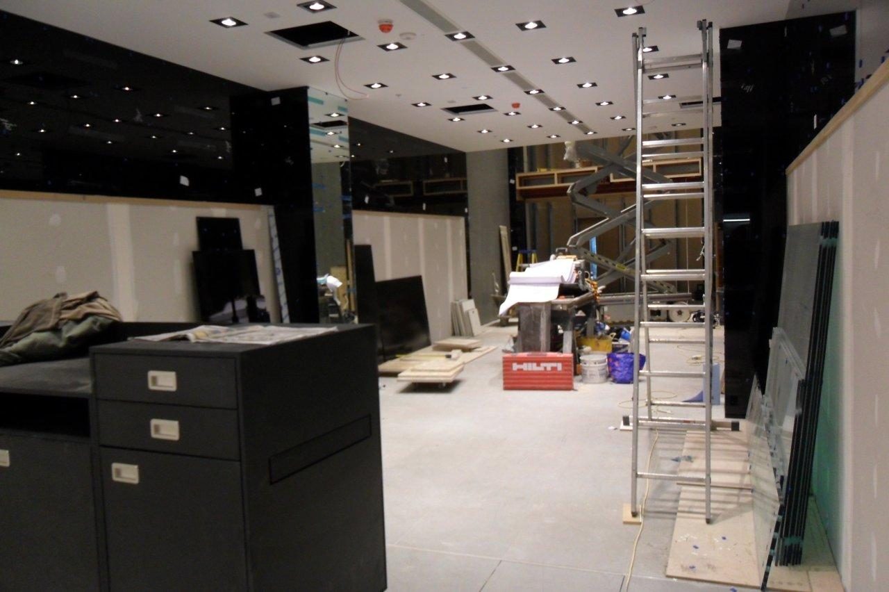 Complete — illuminated display walls and mirrored ceiling