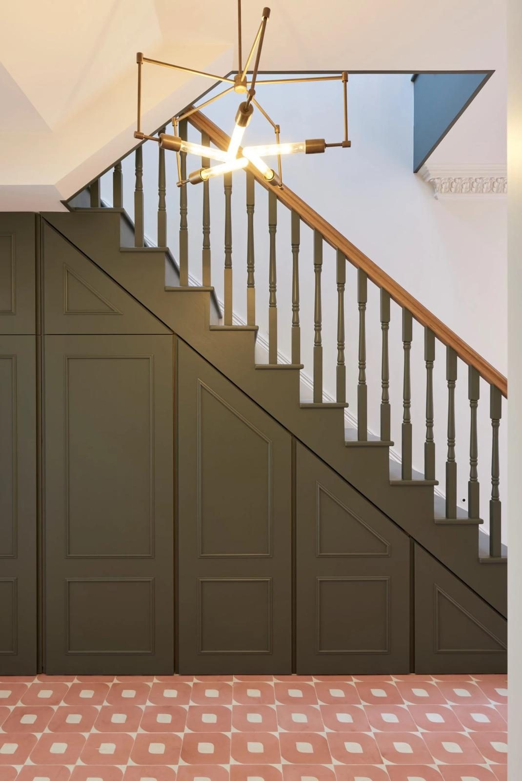 Panelled under-stair storage, built to the stair line