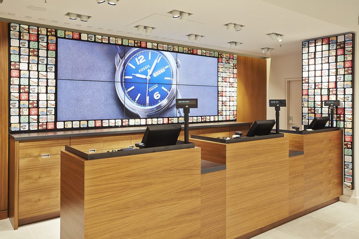 Illuminated watch wall in timber and steel