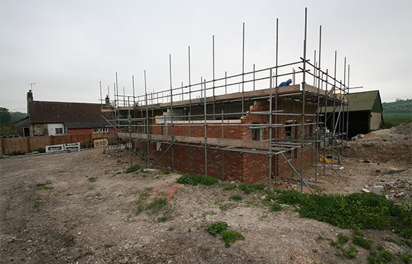 Brick and flint elevations rising
