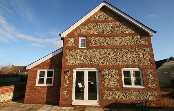 Complete — brick and flint, slate roof