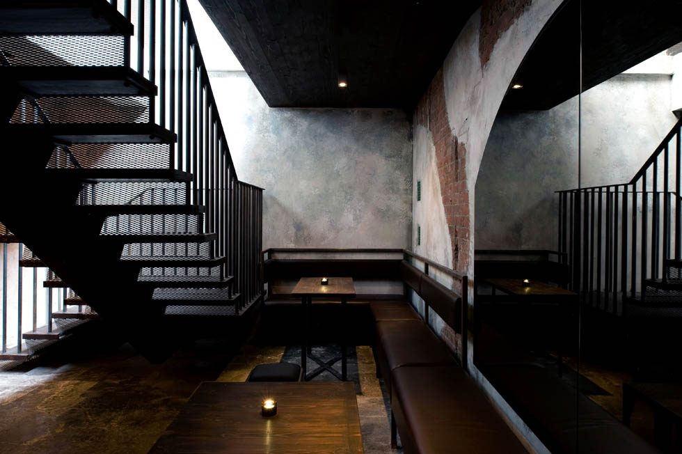 Lounge under exposed beams and spiral ductwork