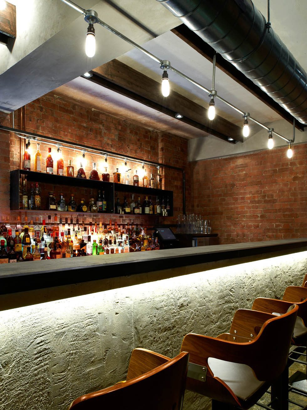 Booth seating beneath the steel stair