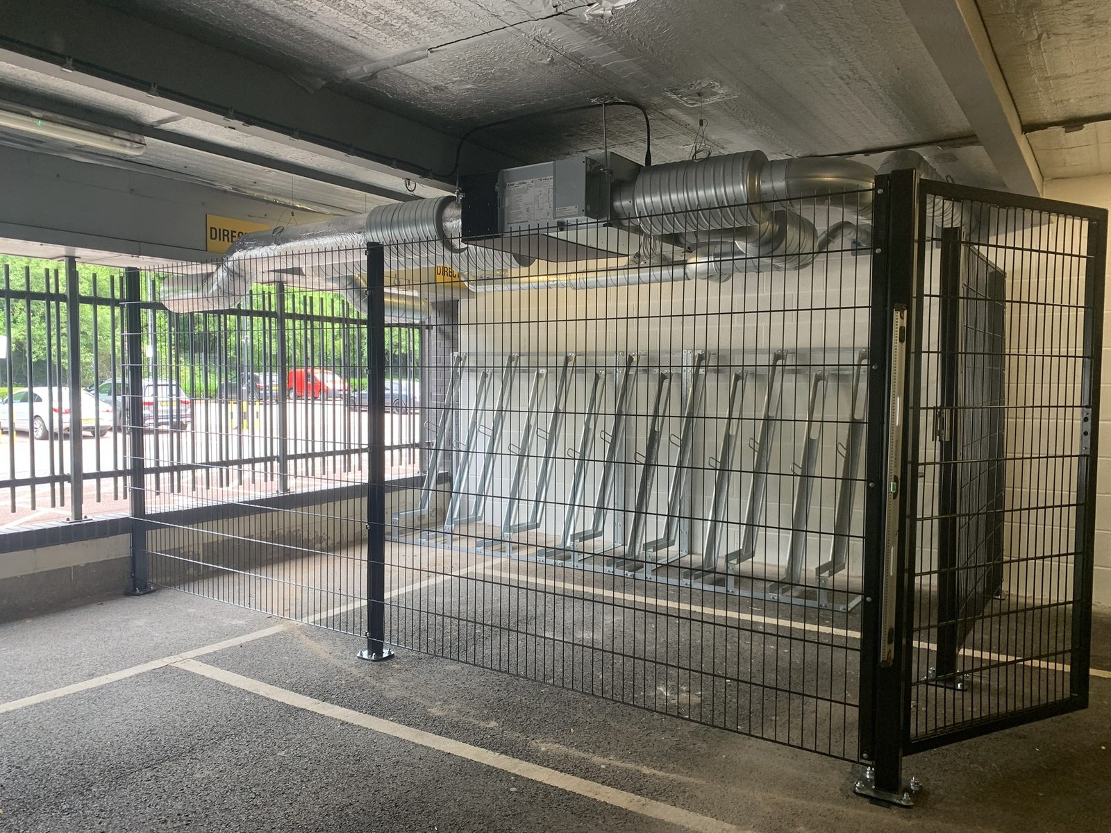 Secure bike store — mesh enclosure and galvanised racks