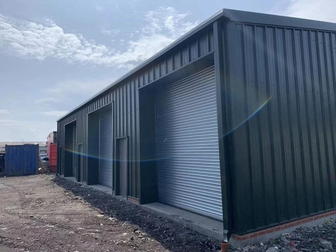 Insulated cladding and roller-shutter bays