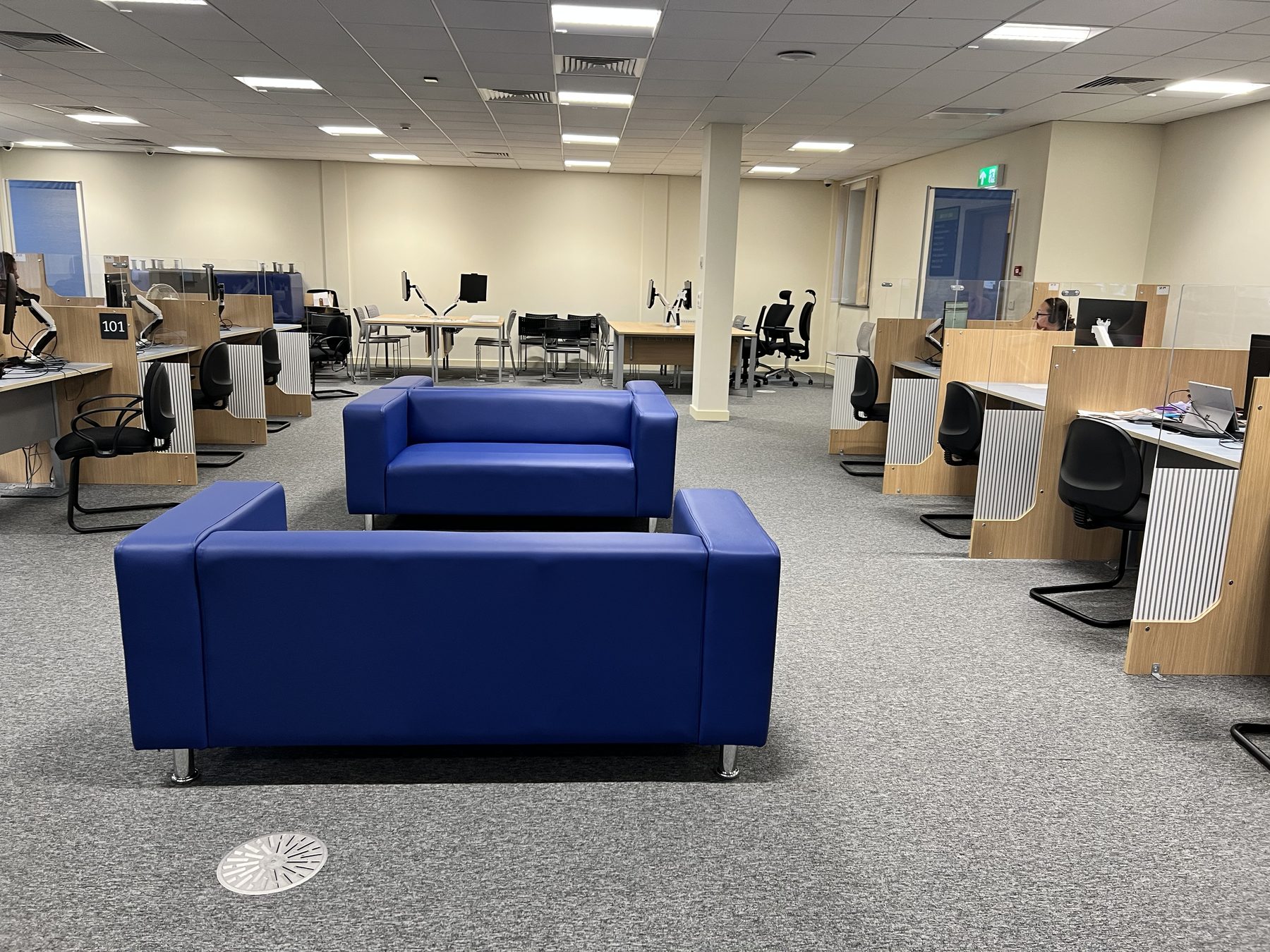 Waiting area and wayfinding — the public side of the floor