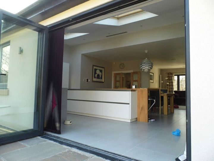 Open-plan kitchen and living space, opened to the garden